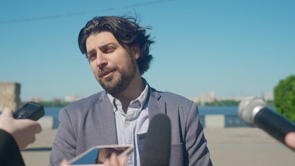 Interview with a news reporter outside in a park