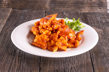 Sweet and Sour Chicken on wood table. Chinese food.