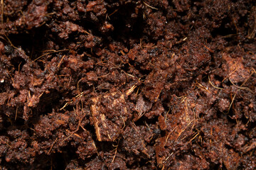 Close Up Of Moist Brown Fresh Soil on a White Background
