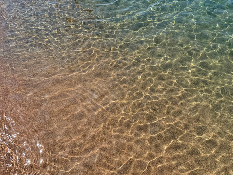 Sea crystal clear water on sandy beach