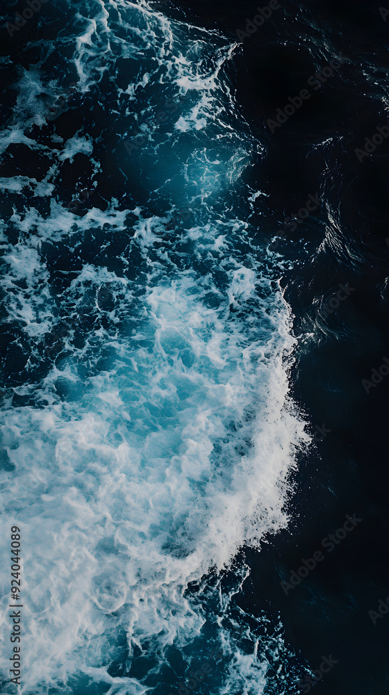 Poster a dark blue ocean wave crashes powerfully, with white foam splashing over the surface, creating a dy