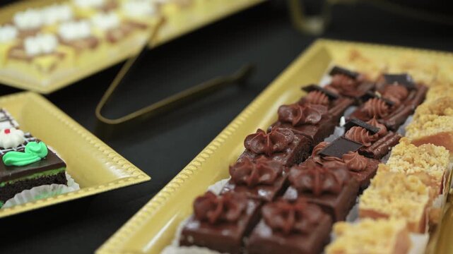 Candy bar, Sweets on stands. Delicious desserts at the banquet, sponge cakes, shortbread tarts. Close up view move view