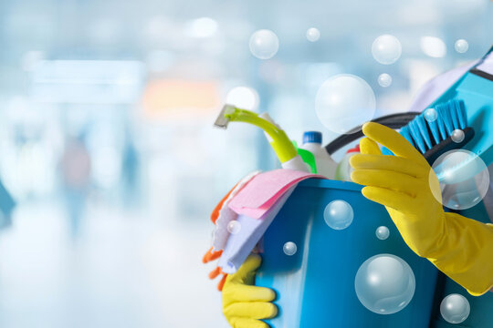 A cleaning lady clicks on virtual bubbles.