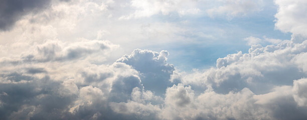 Bright sunlit white curly clouds on a fine day