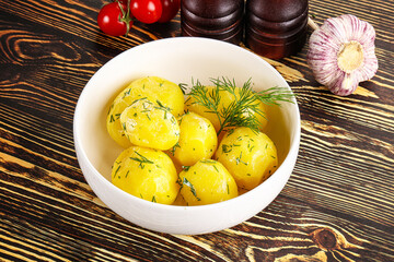 Boiled potato with oil and dill