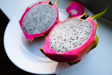 vibrant dragon fruit or pitaya half cut on white background