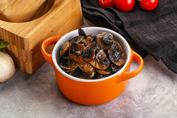 Roasted champignon mushrooms in the bowl