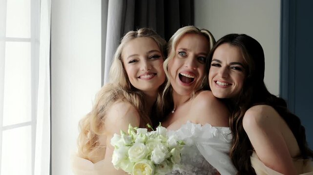 Bride and bridesmaids sharing a joyful moment, A heartwarming image capturing a joyful moment between the bride and her bridesmaids