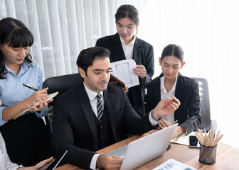 Diverse of business people from various ethnic group working in modern office environment. Productive and multi ethnic office workers engage in discussion for strategic business marketing. Meticulous