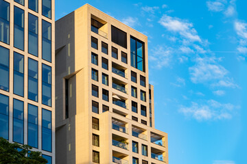 fragments office and residential buildings in European city with reflective glass facades, modern high-rise office buildings and residential towers