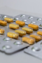 Colorful pills on white background, motion blur and focused pills.