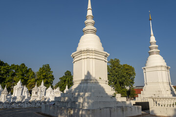 a grouping of whitewashed mausoleums, which house the cremation ashes of members of the royal family of Chiang Mai in Wat Suan Dok, Chiang Mai, Thailand