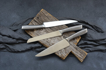 Casting steel various chef knife, Set of modern sharp kitchen knives on dark background