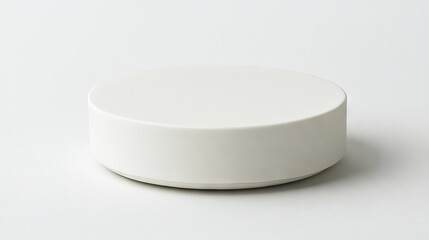   A high-resolution image of a close-up white object placed on a stark white background, with a slight source of illumination emanating from above