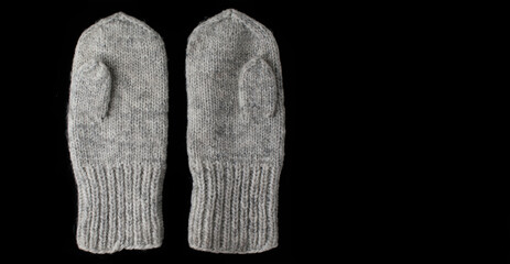 Winter mittens on a dark background