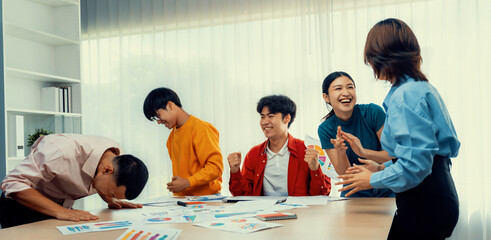 Excited and happy startup company employee celebrate after make successful strategic business...