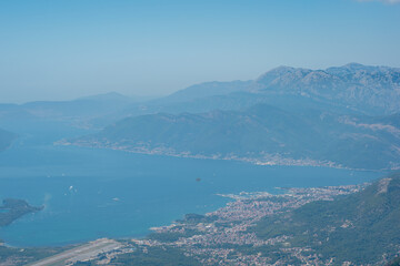 Obraz premium view from the top of the mountain on Boka bay in Montenegro on a sunny day. Adriatic Sea Bay seen from mountains.