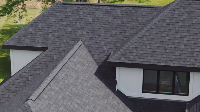 Drone footage of new roof is installed on a private house. Day time