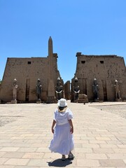 Girl looking at the Luxor Temple