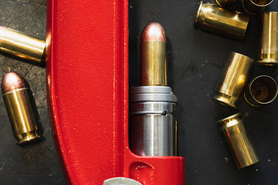 Reloading 45 caliber pistol cartridges. Firearms.