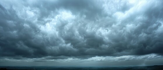 Obraz premium Moody Overcast Sky with Thick Gray Clouds Blanketing Horizon for Weather or Nature Concept