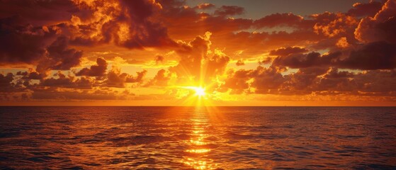 Serene Golden Sunset over the Ocean with Scattered Clouds