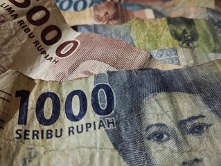 Indonesian currency rupiah on brown table background