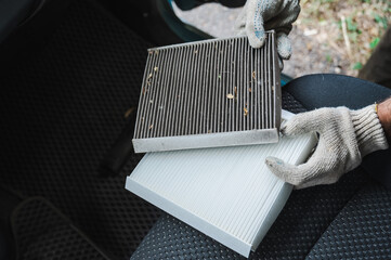 The master changes the cabin air filter of the car.