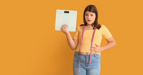 Shocked overweight girl with measuring scales on color background