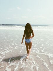 woman walking on beach