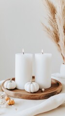 Candles of various sizes illuminated among pumpkins, pine cones, and autumn leaves create a warm and inviting autumn centerpiece on a rustic wooden board