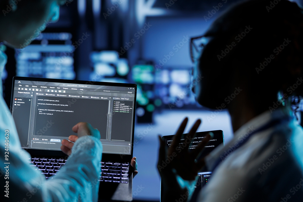 Poster trained programmers build firewall systems in server room housing advanced infrastructure. skilled p