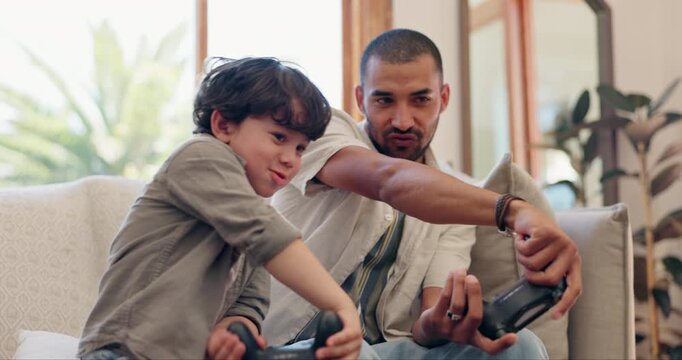 Father, son and video game controller on sofa, happy and with bonding, click and competition in family house. Dad, child and together for gaming, contest and learning with fun on living room couch