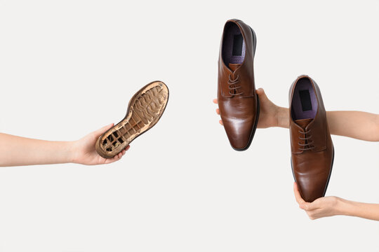 Female hands with shoes and sole on white background. Shoe repair concept