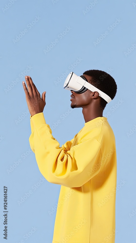 Poster an african american man engages with virtual reality, extending his hand to interact with digital el