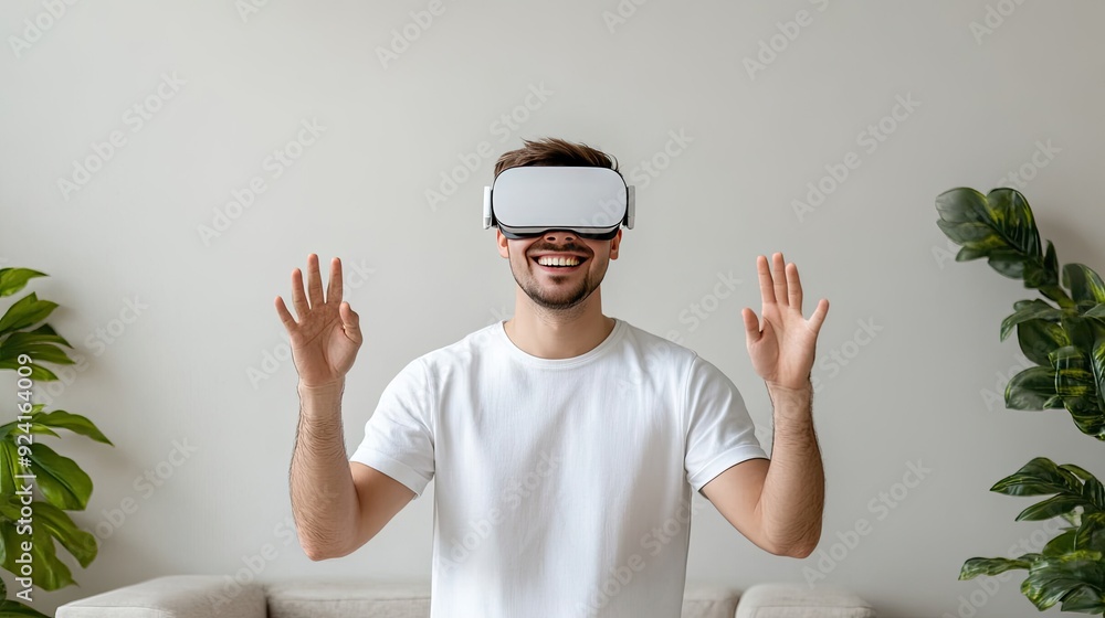 Poster a young man is smiling and gesturing joyfully while immersed in a virtual reality experience at his 