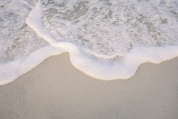 Sea foam on the ocean shore
