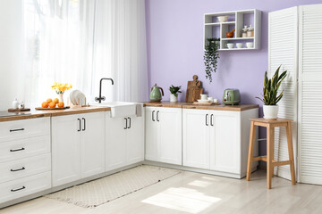 Stylish interior of kitchen with counter