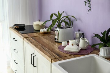 Interior of modern kitchen with counter