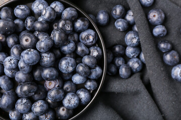 Plate with sweet fresh blueberries on napkin, closeup