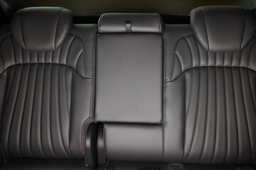 Obraz premium Car back seat with headrest and arm rest, a comfortable automotive fixture
