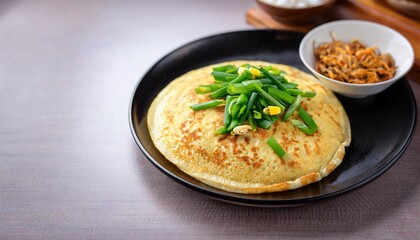 Jianbing a thin crepe with egg, spring onions and various fillings