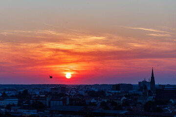 Sunset over Osijek, Croatia with vibrant colors illuminating the skyline