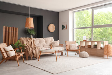 Sofa with armchairs and coffee table in living room