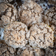 Pumpkin cream cheese muffins with strudel topping close-up, top-down view.