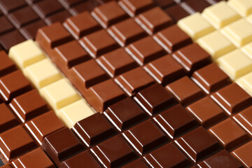 Different sweet chocolate bars as background, closeup