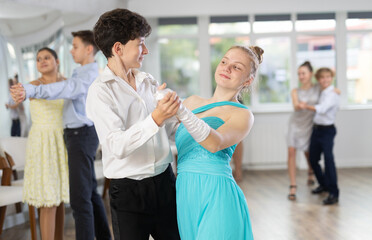 Viennese Waltz performed by teenage girls and boys in a dance studio