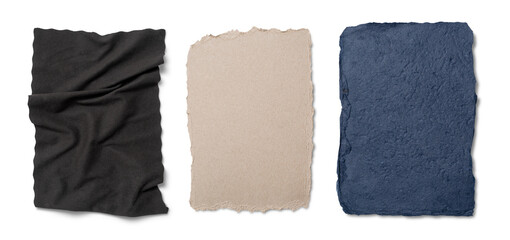 A collection of textured materials in black, beige, and navy, carefully arranged to highlight their distinct colors and surfaces