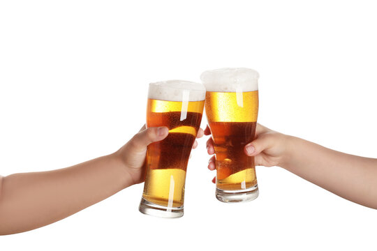 Female hands with pints of fresh beer on white background