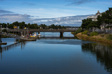 A water view at Seaside, Oregon showing water with a bridge and reflections on a beautiful summer day_08172019_6699.